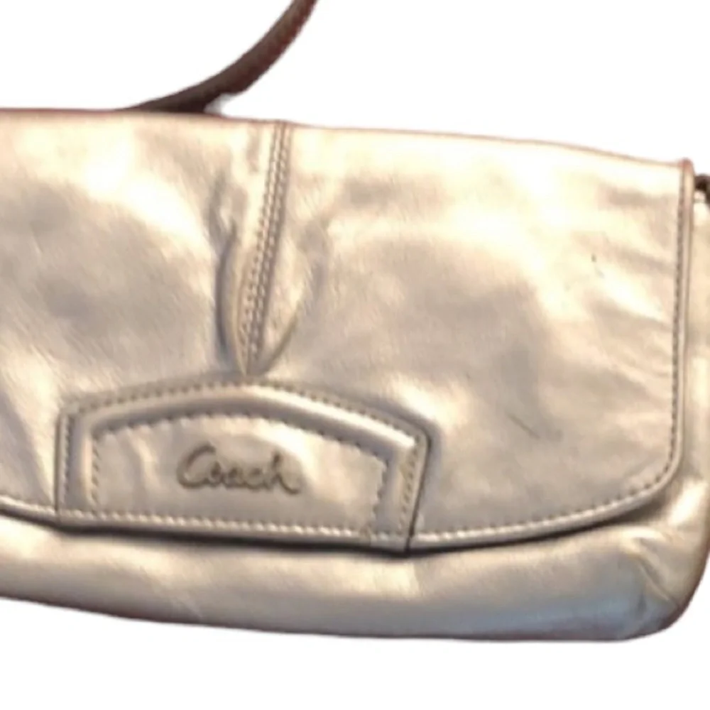 Coach  silver metallic genuine leather large wristlet or clutch 9” long  …